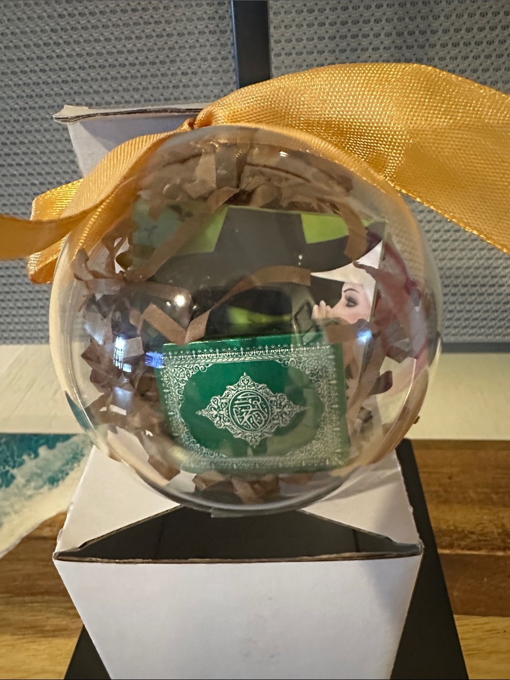 Clear Holiday Ornament with Gold Ribbon and Green Insert. Wicked